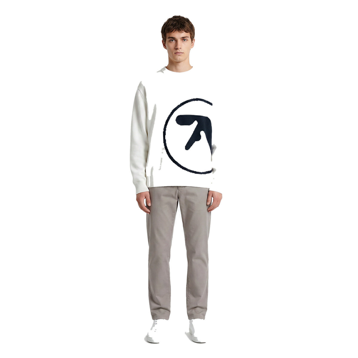 Model wearing the oversized knit graphic sweater in white