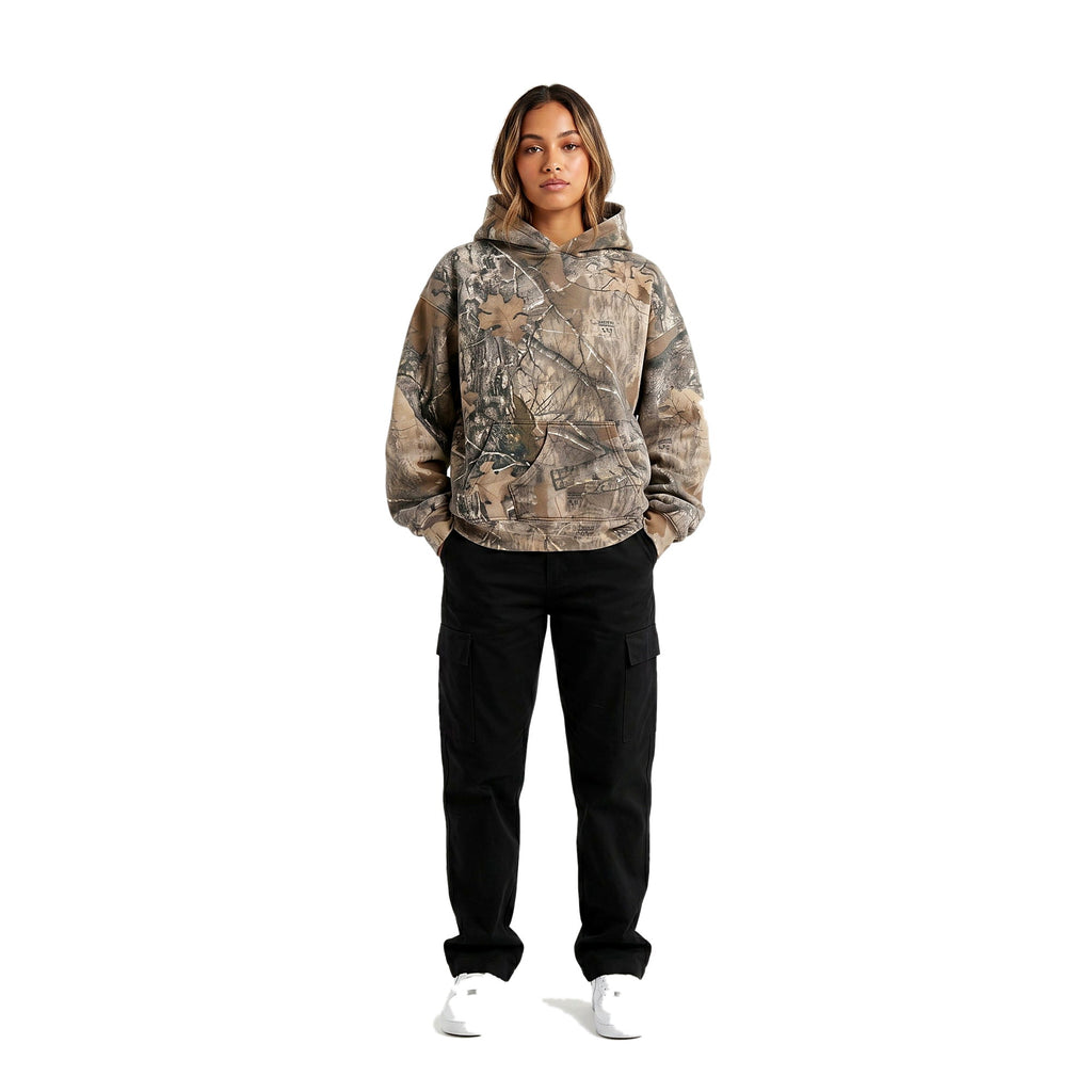 Woman wearing the camo oversized pullover hoodie