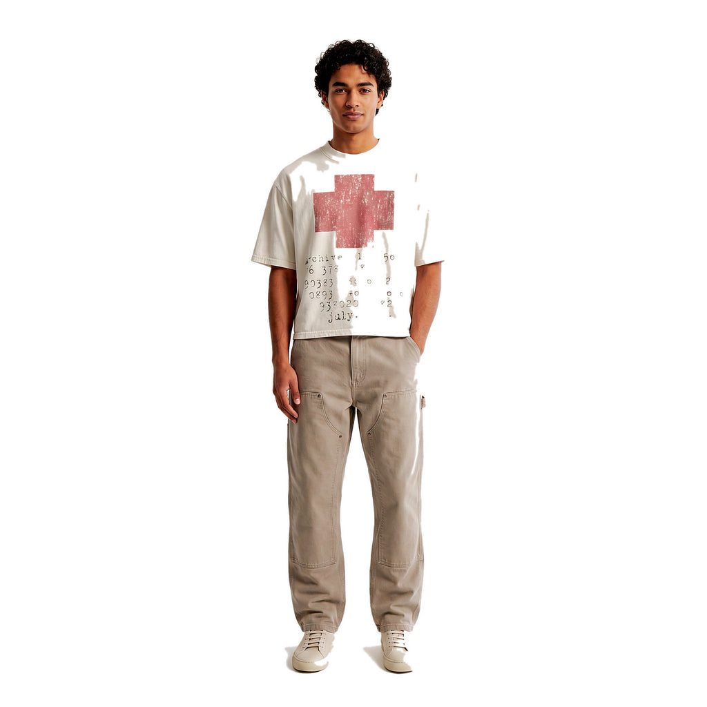 Model wearing the distressed cross cropped tee, streetwear
