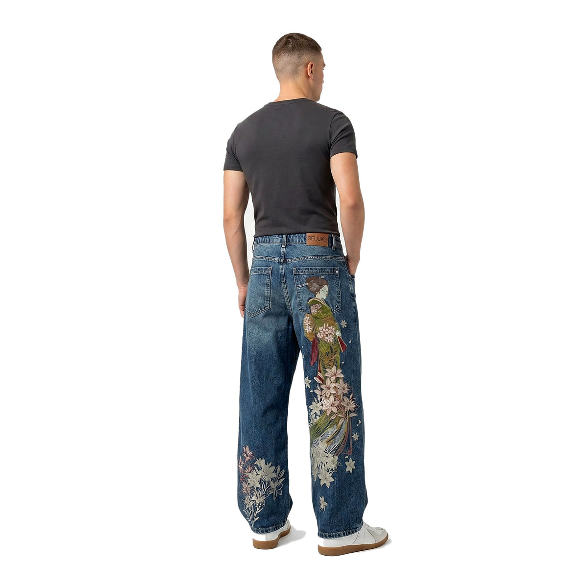 Back view of embroidered baggy wide-leg jeans in a light wash