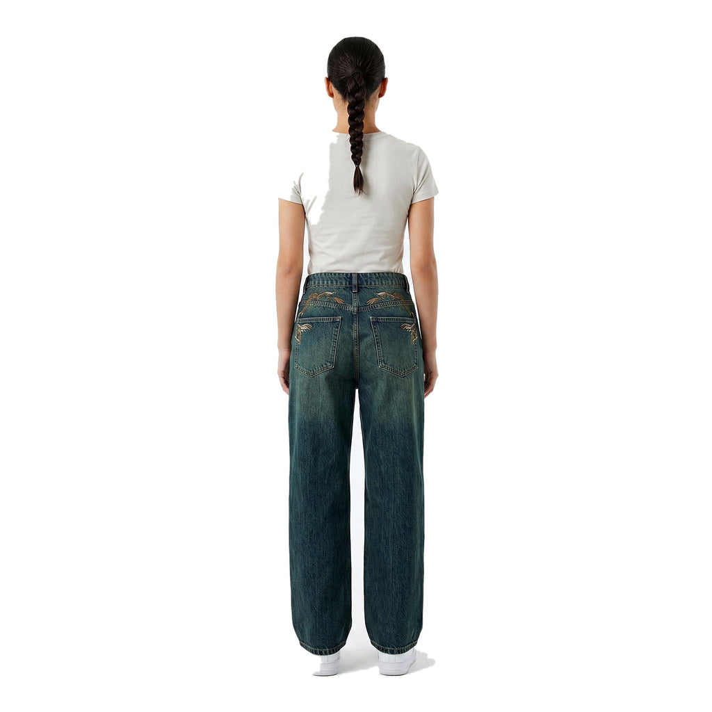Rear view of embroidered wide-leg baggy denim jeans