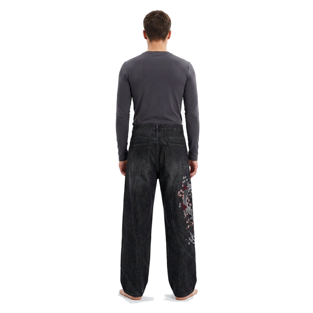 Back view of embroidered baggy jeans in a dark wash