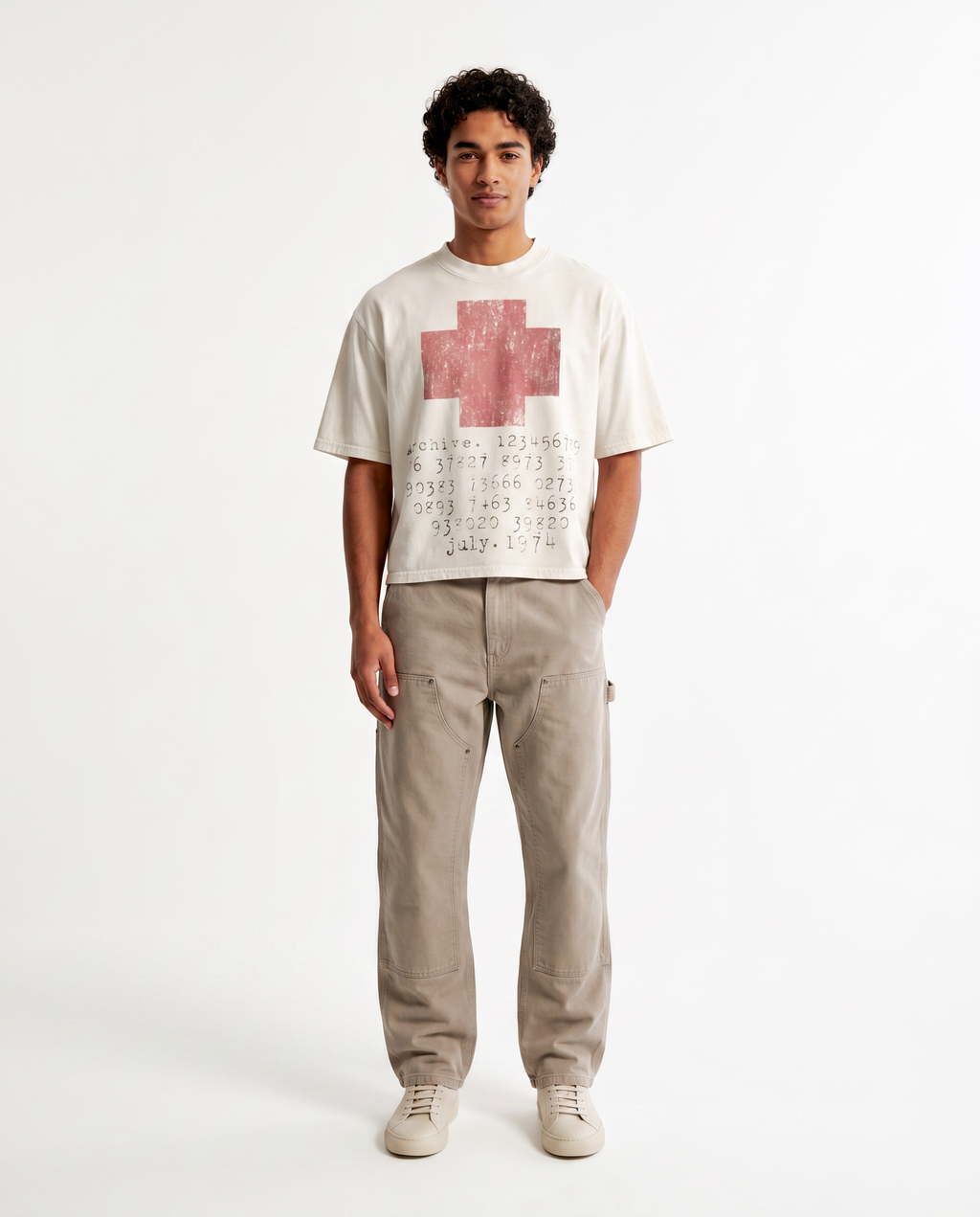 Model wearing the distressed cross cropped tee, streetwear