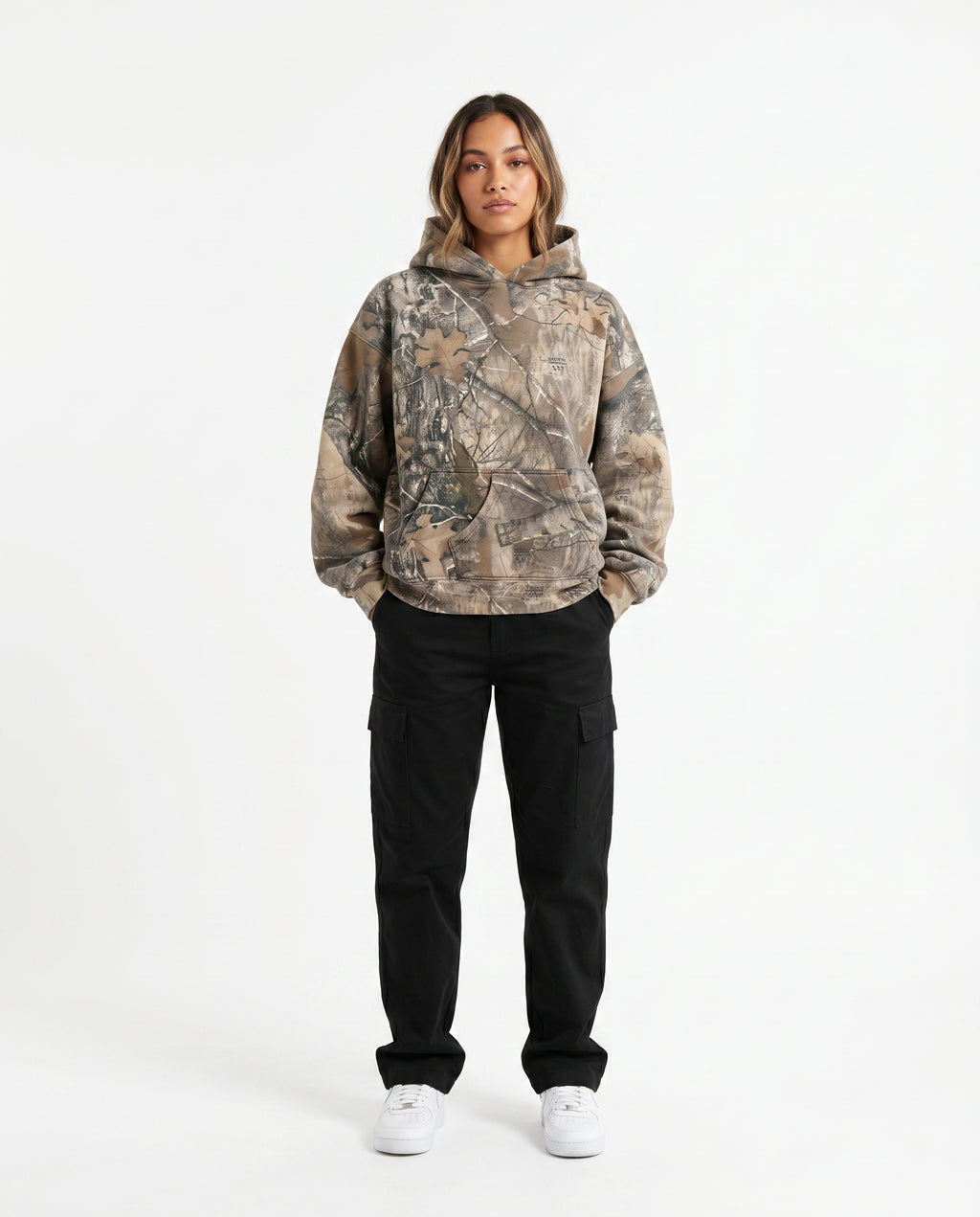 Woman wearing the camo oversized pullover hoodie