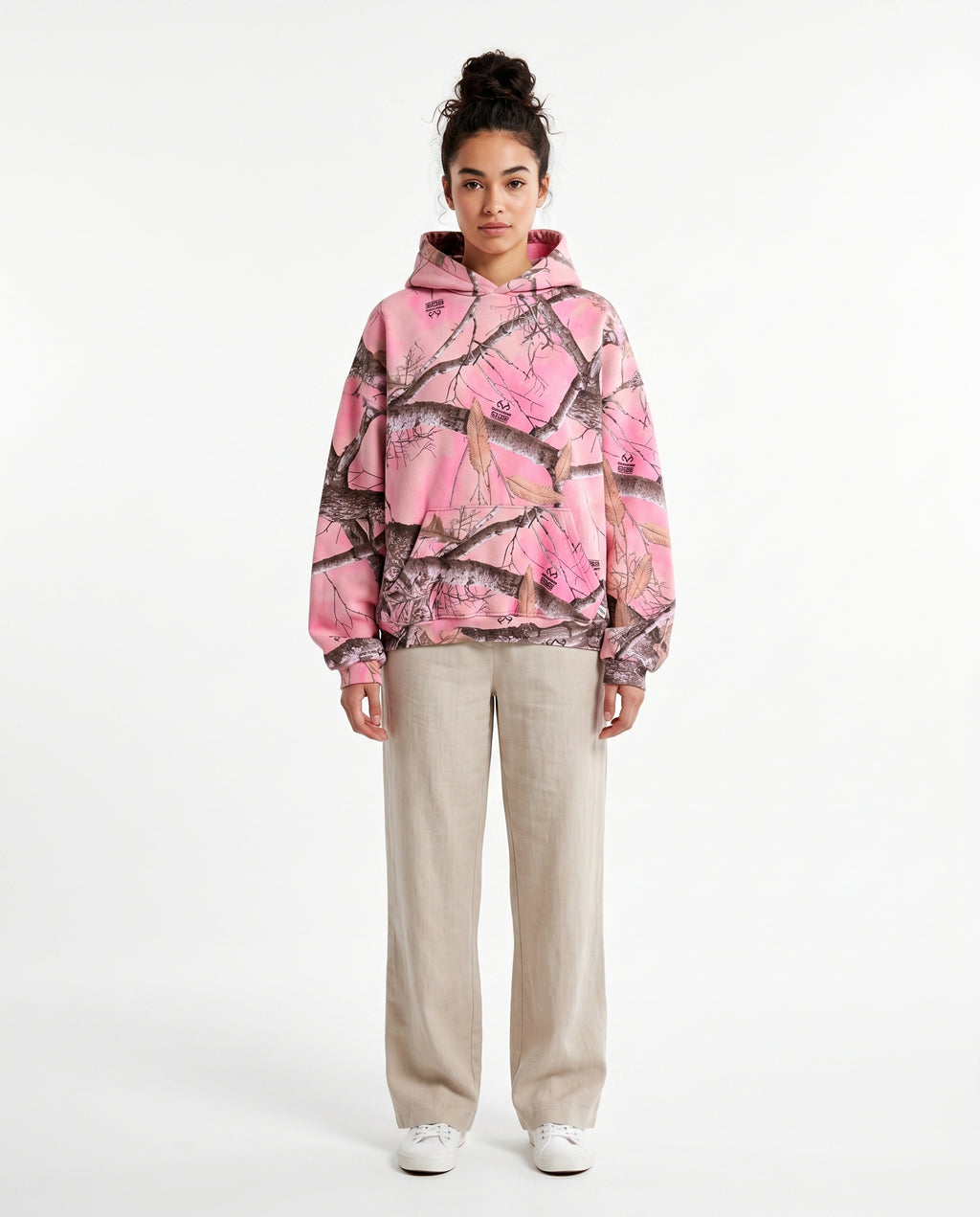Female model in the pink camo pullover hoodie