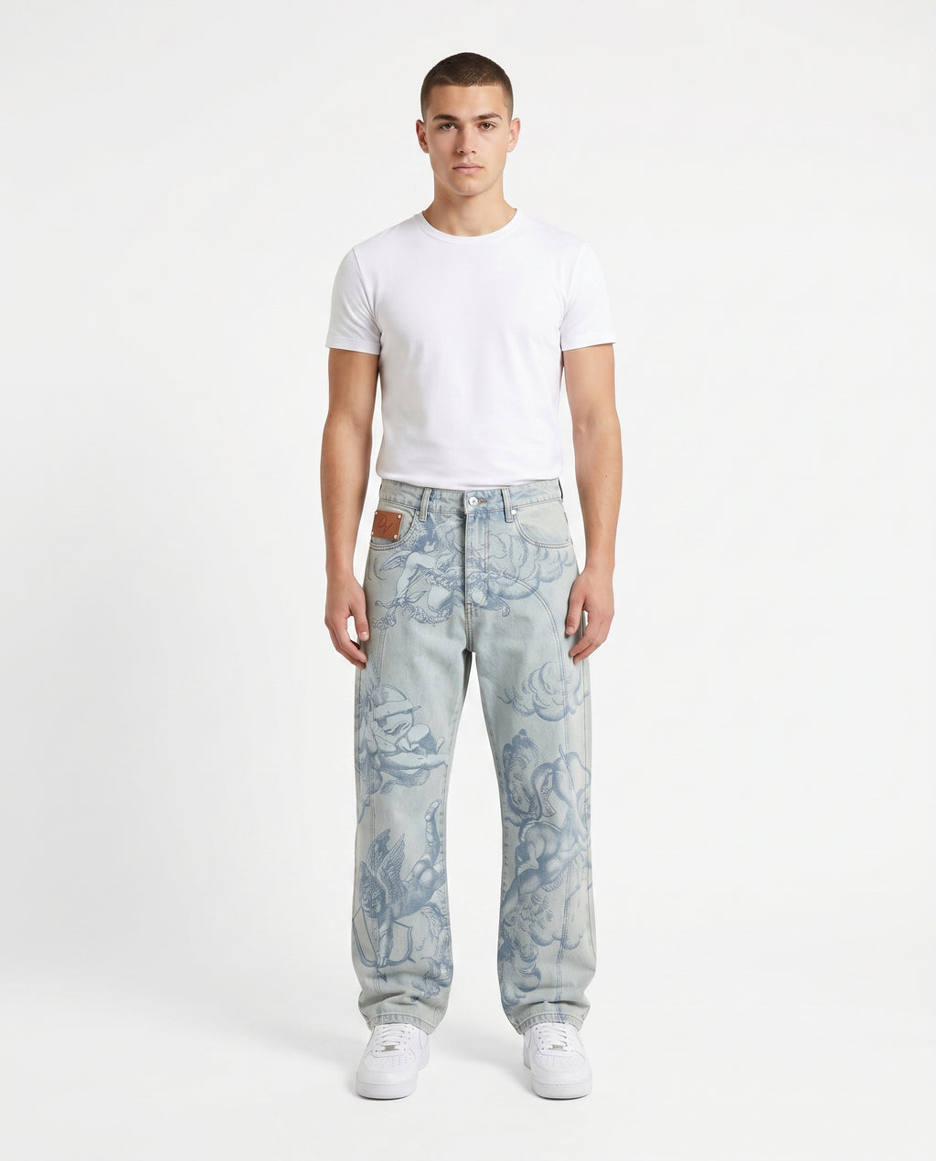 Male model in the angel embroidered baggy jeans, light blue