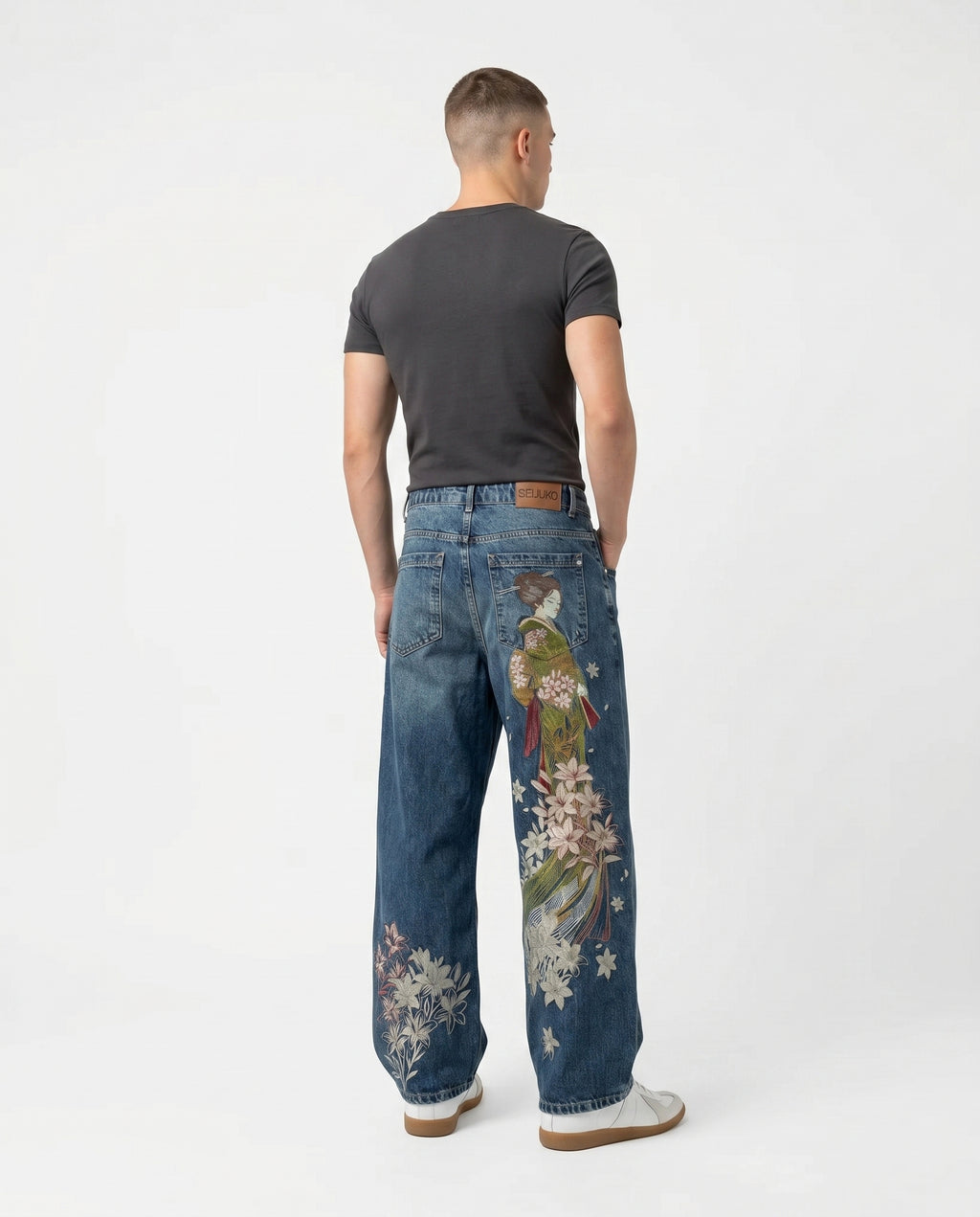 Back view of embroidered baggy wide-leg jeans in a light wash