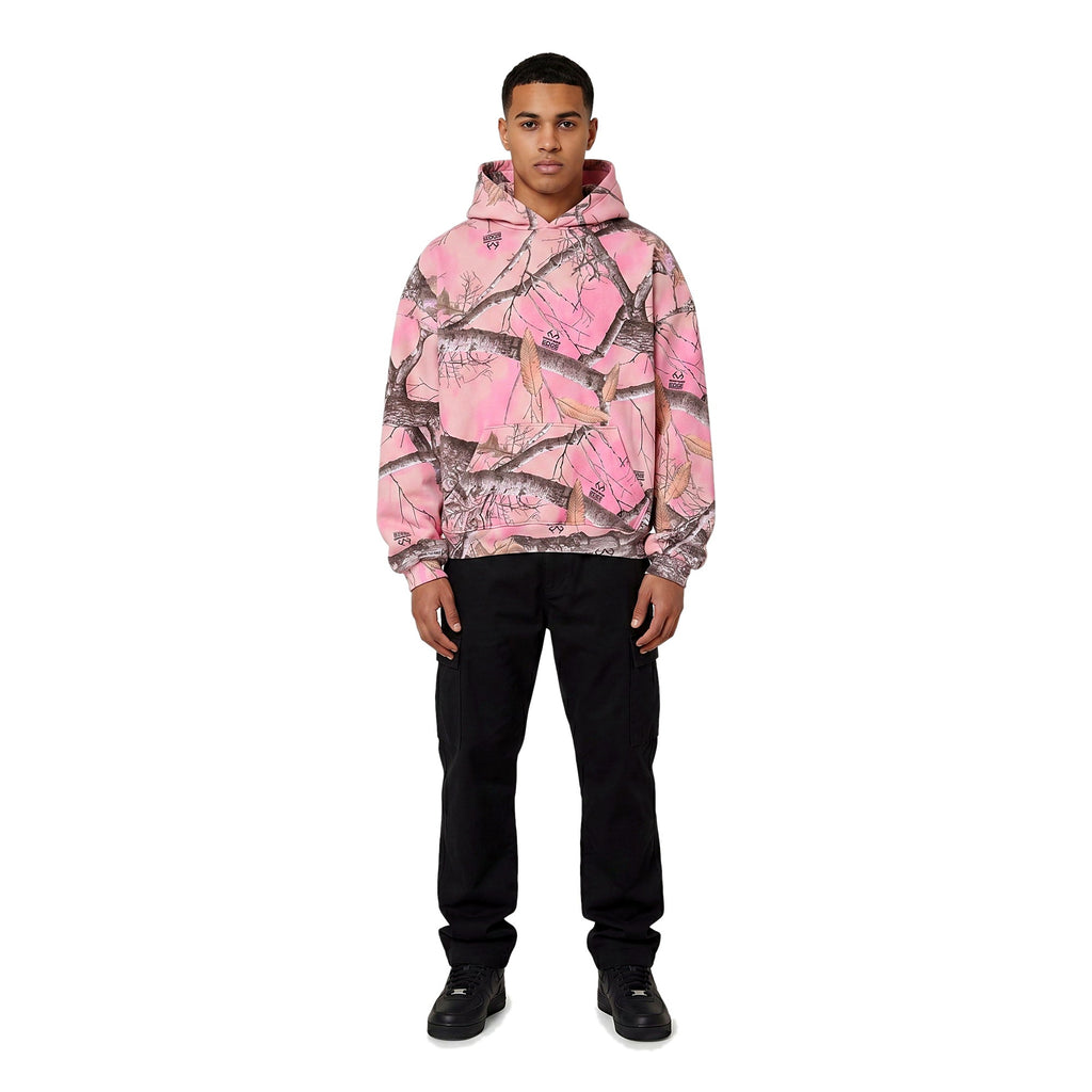 Man wearing the pink camo pullover hoodie, no zip