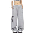 Star embroidered baggy joggers in grey — detail view